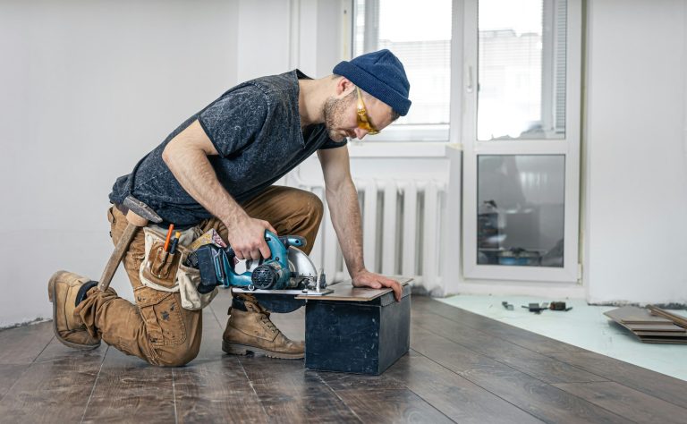 Circular Saw, carpenter using a circular saw for wood.